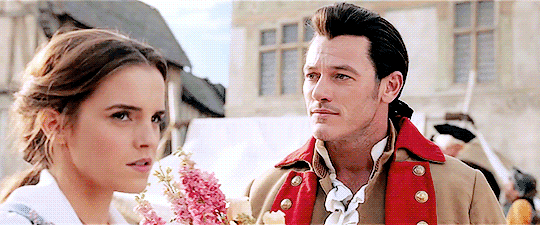 Belle shaking her head at Gaston.