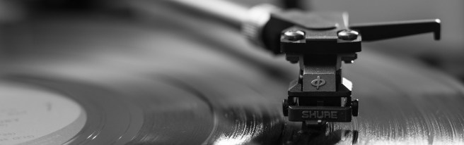 Record player needle on a record